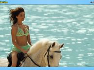 Sexy Italian Actress In Bikini Riding Horse Along The Beach - clothed brunette model